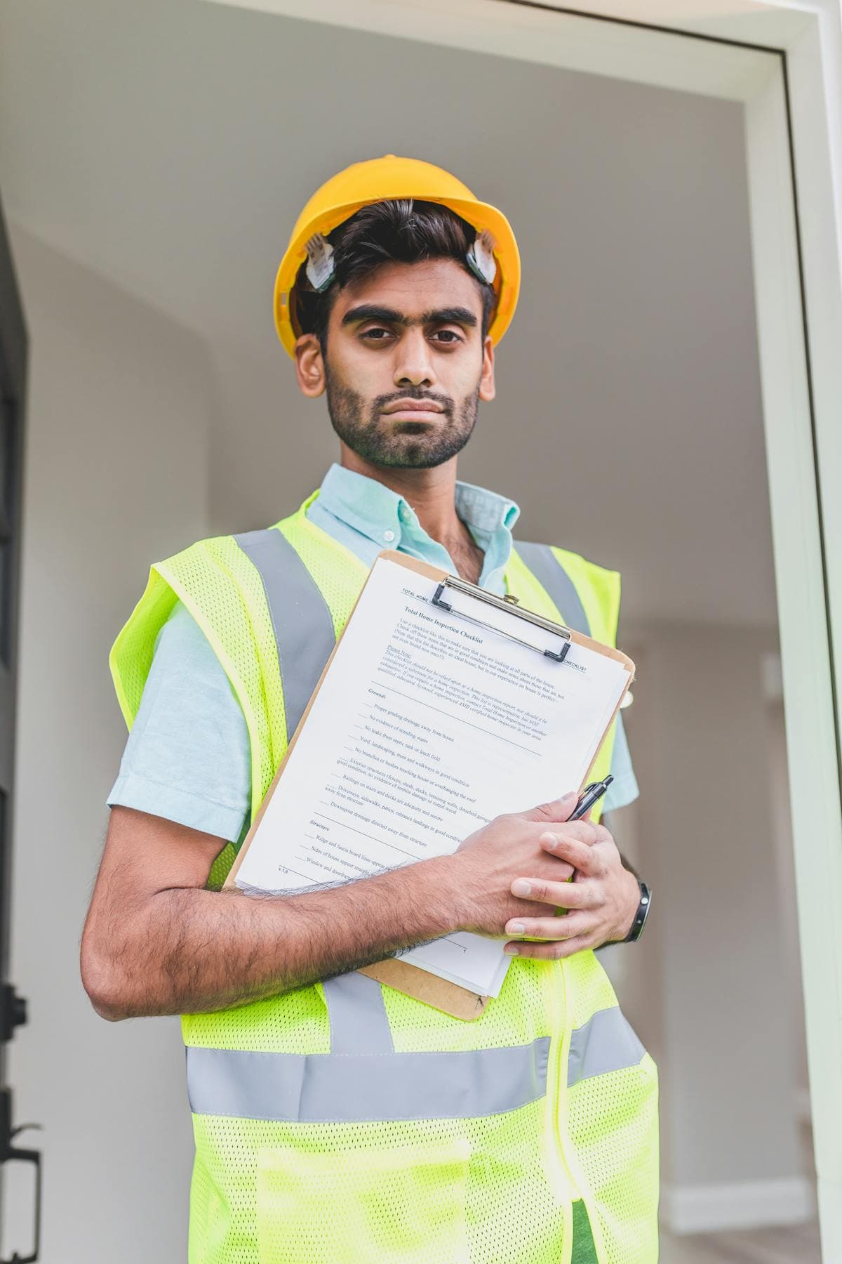 Indian construction workers needing document attestation from India at a Gulf building site
