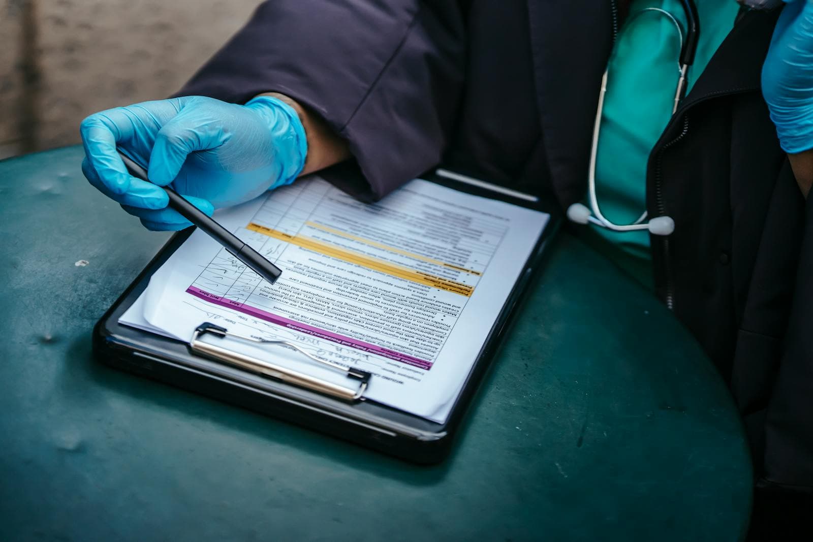 Physician reviewing a medical document illustrating SiZA Global medical translation desk for Saudi SCFHS, UAE DOH, UK GMC, AHPRA Australia and ECFMG submissions