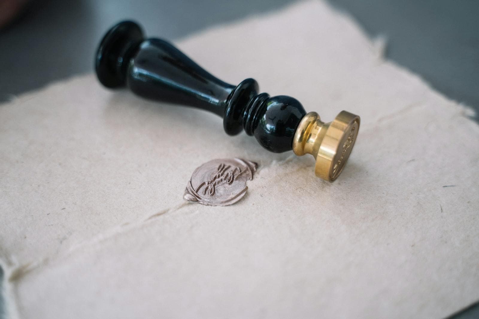 Close-up of an MEA apostille or embassy attestation stamp being pressed onto an Indian-issued document, illustrating SiZA Global Noida sworn translation work