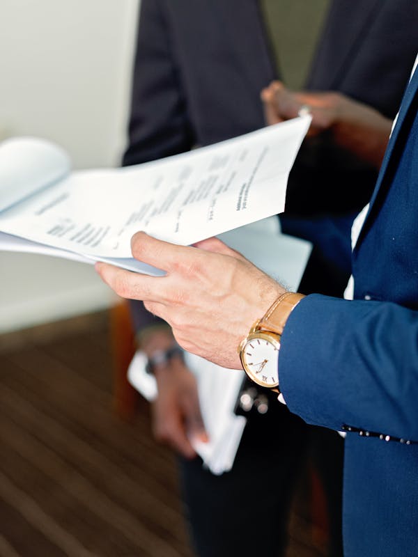 Indian business professional checking company documents