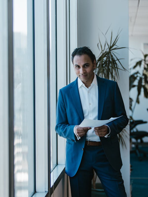 Indian professional reviewing documents for overseas use