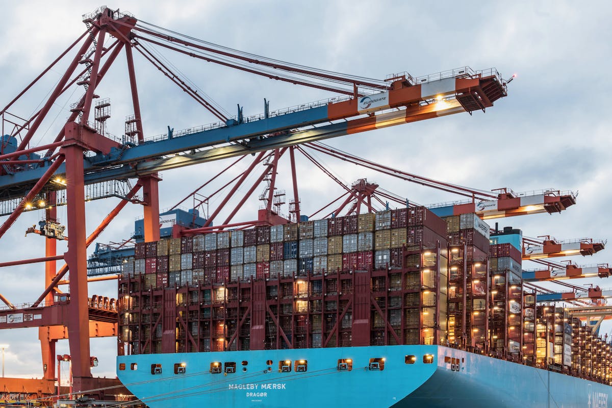 Cargo ship loaded with shipping containers at a commercial UAE dock