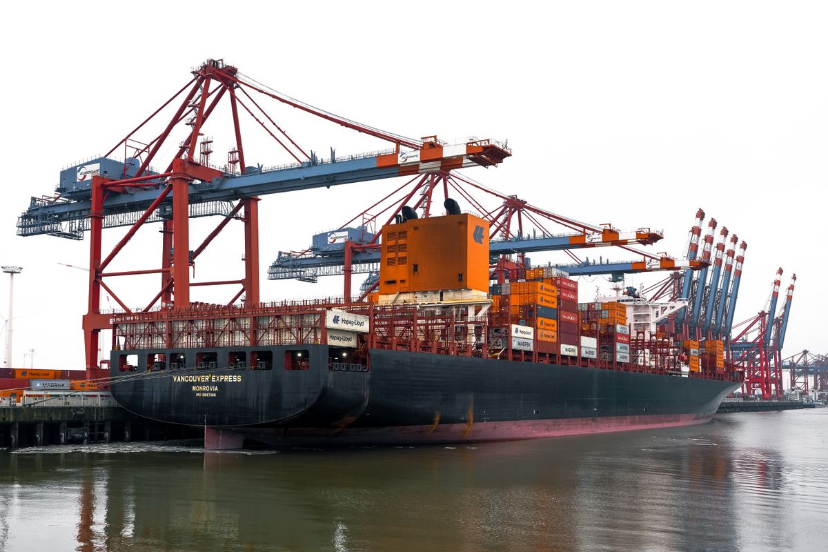 Container ship and cranes at the Hamad Port in Qatar