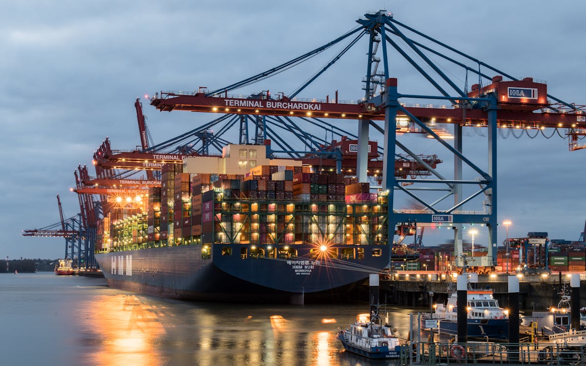 Container ships moored at the Shuwaikh terminal in Kuwait at evening