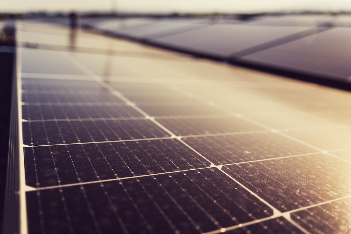Indian renewable energy engineer inspecting solar panels at a German plant, the kind of move that needs degree apostille
