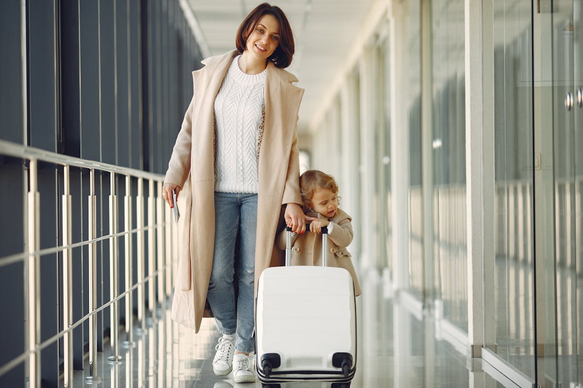 Indian family with luggage arriving at a UAE airport ready to join the sponsor