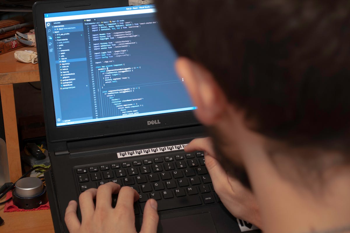 Indian fintech engineer coding at a London workspace, needing a degree apostille attestation in India for the UK Skilled