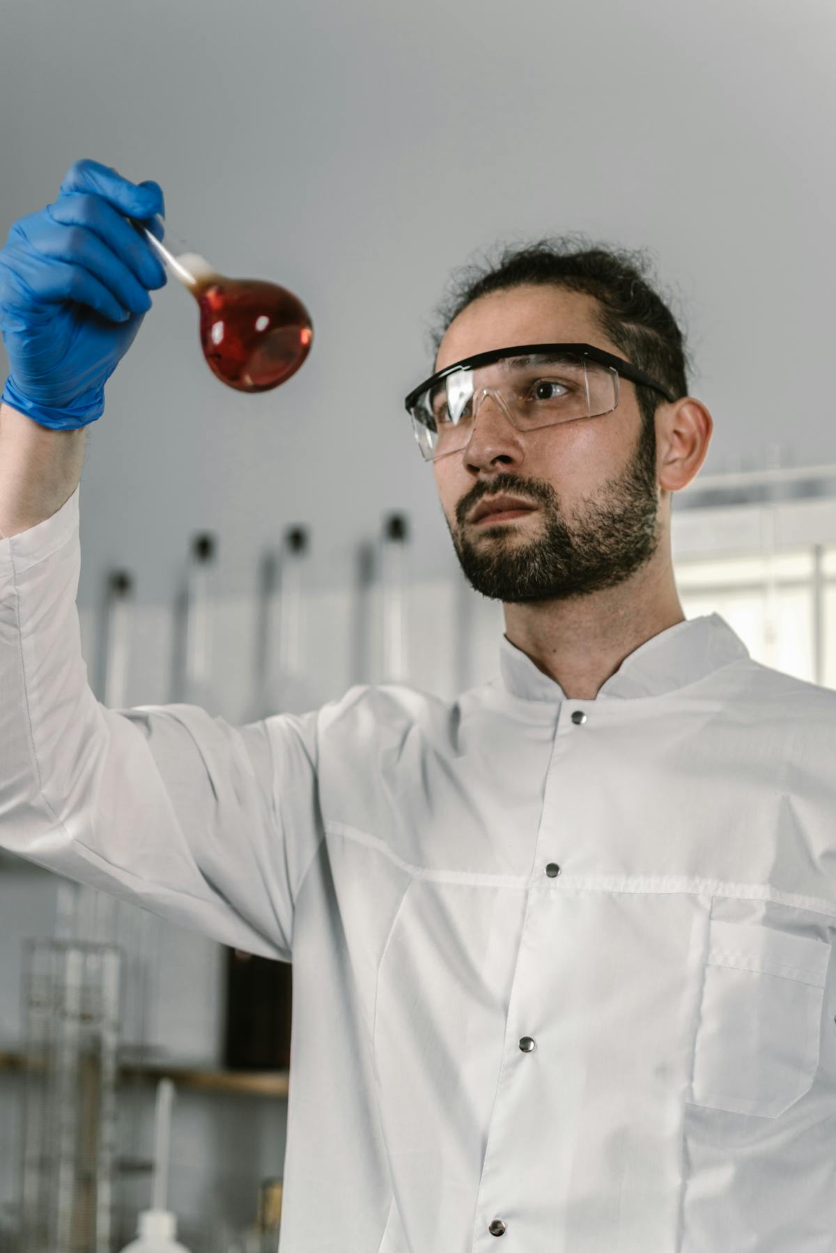 Indian PhD researcher working at a German Max Planck or Helmholtz lab bench