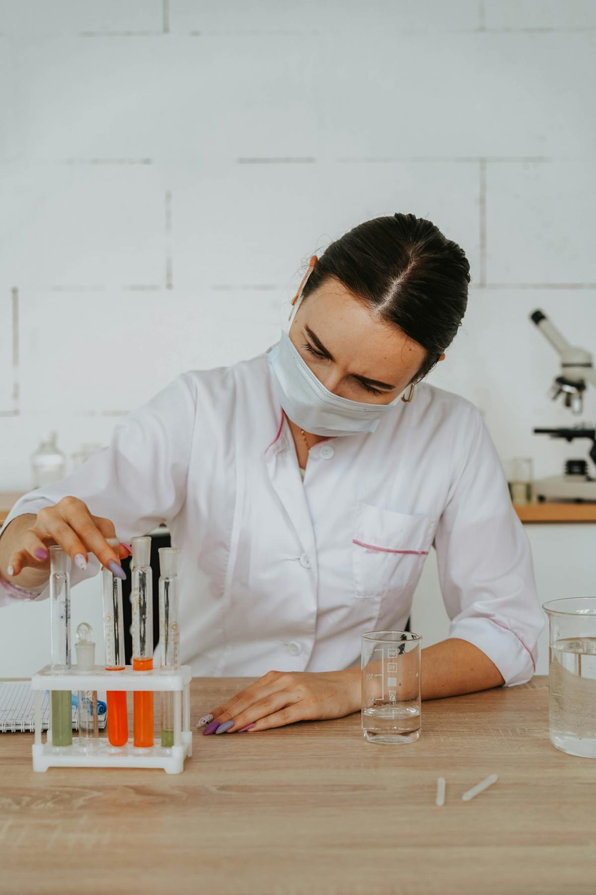 Indian PhD scholar conducting research at a US university lab bench