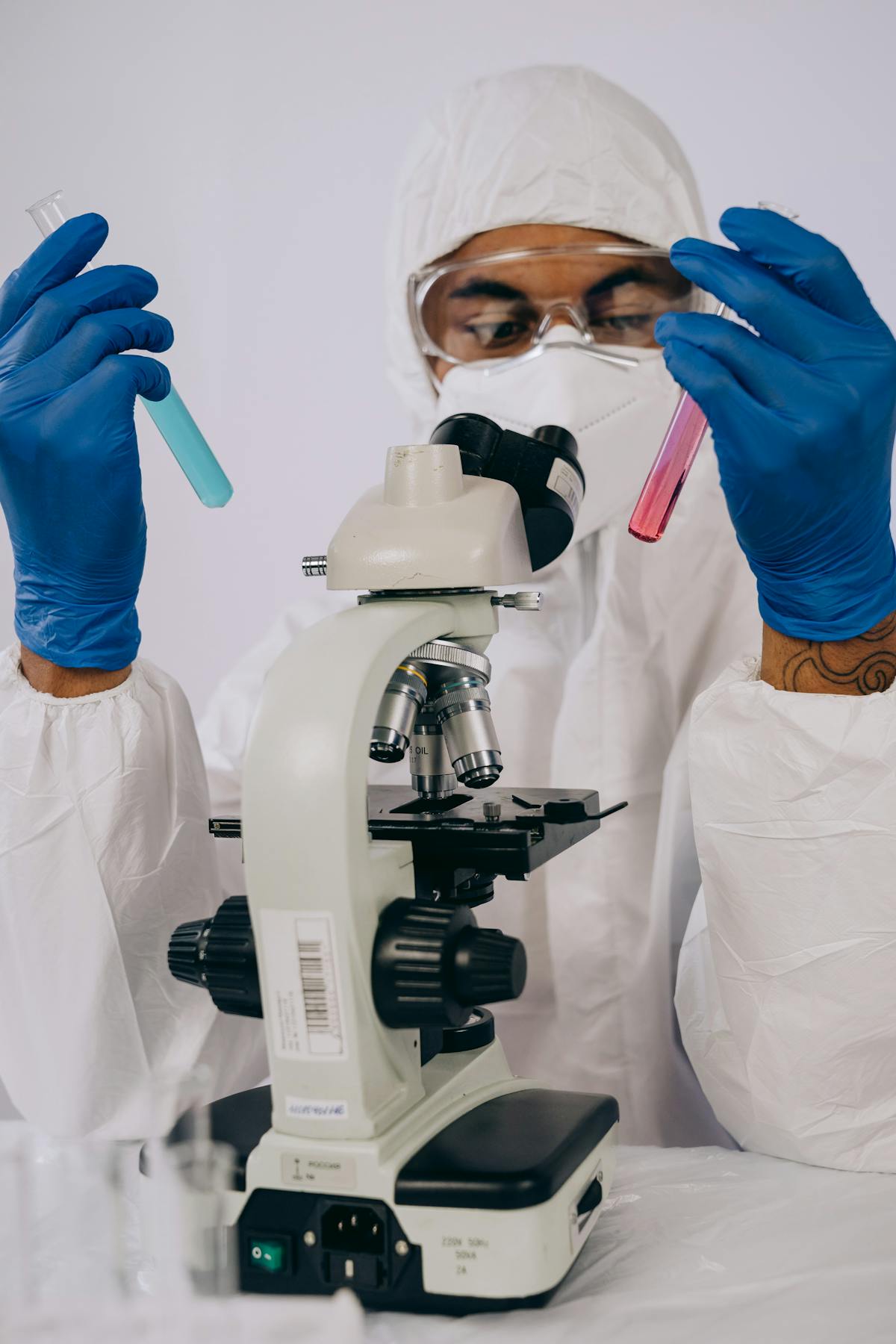 Indian research scientist examining samples at an Australian university lab