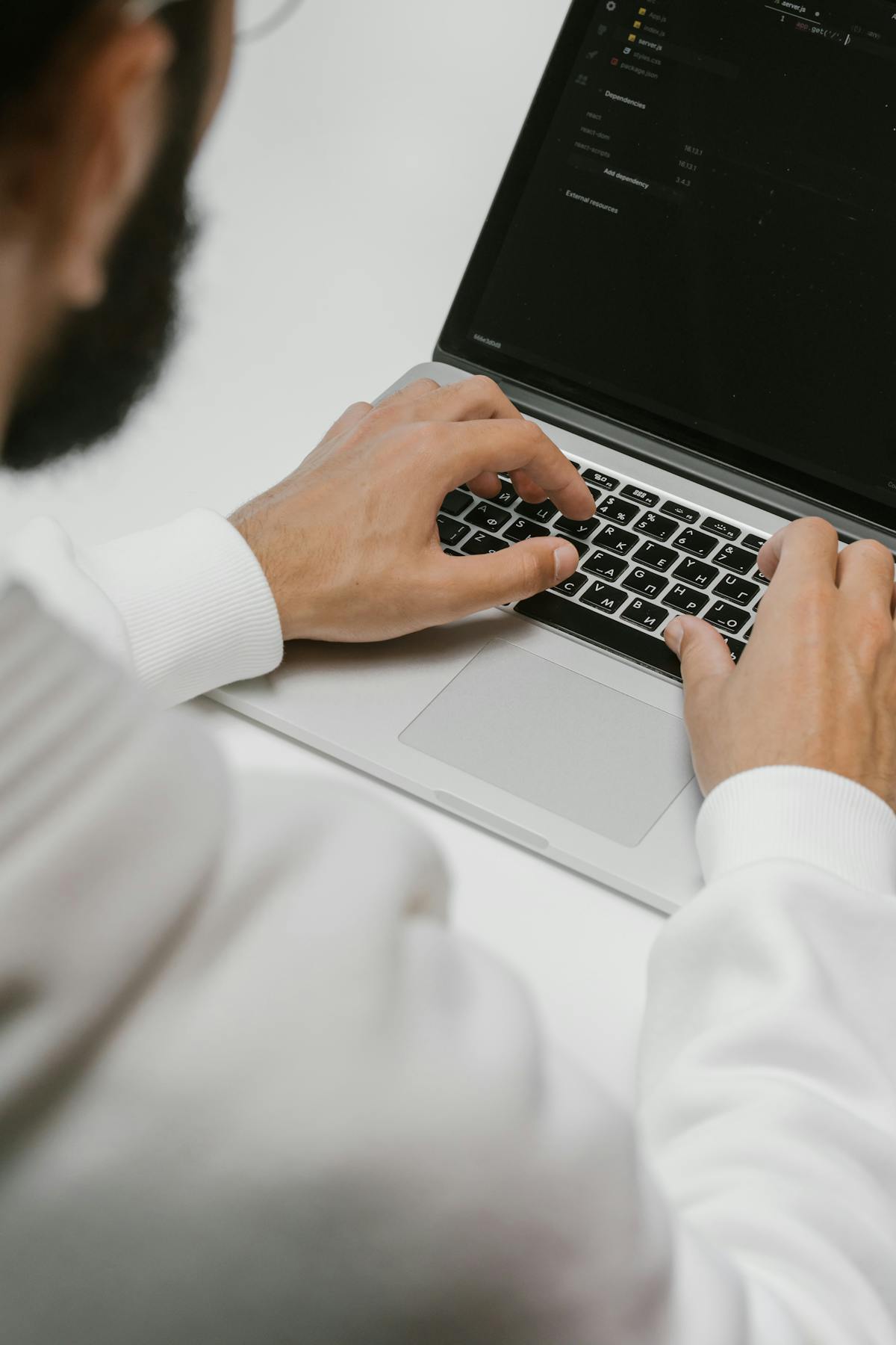 Indian software engineer focused on coding at a Tokyo workspace