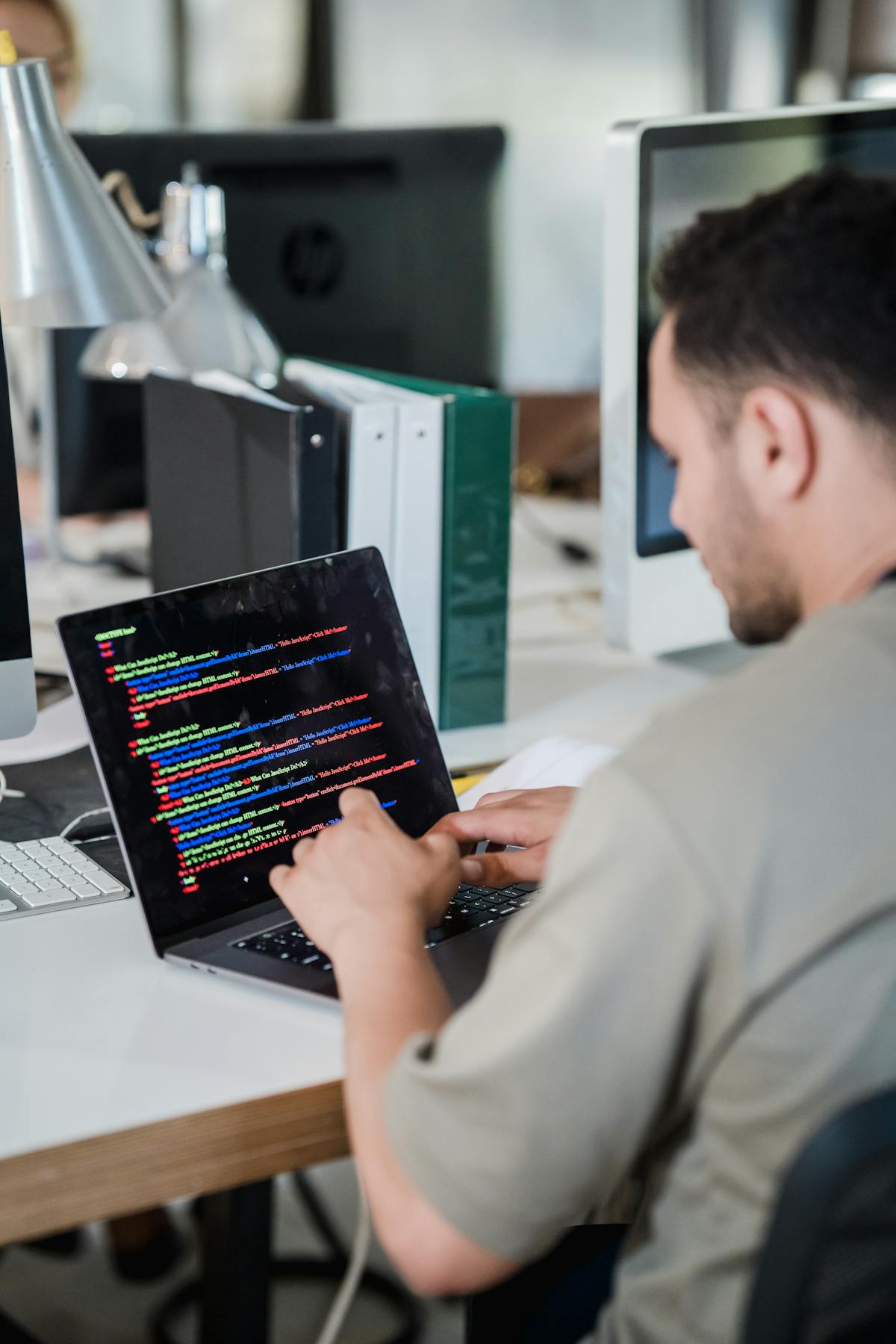 Developer checking website code during multilingual localization QA