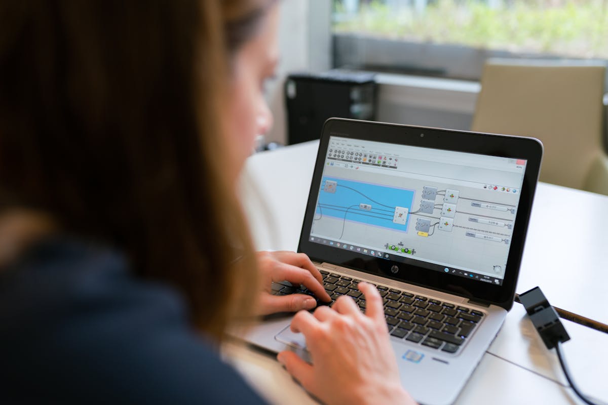 Indian engineer reviewing software code at a German tech workspace