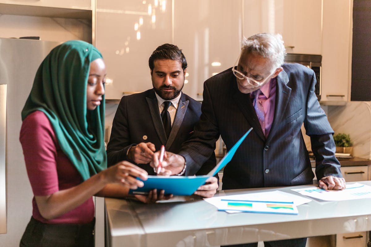 Indian-origin UK business owner working at a desk in a Leicester showroom