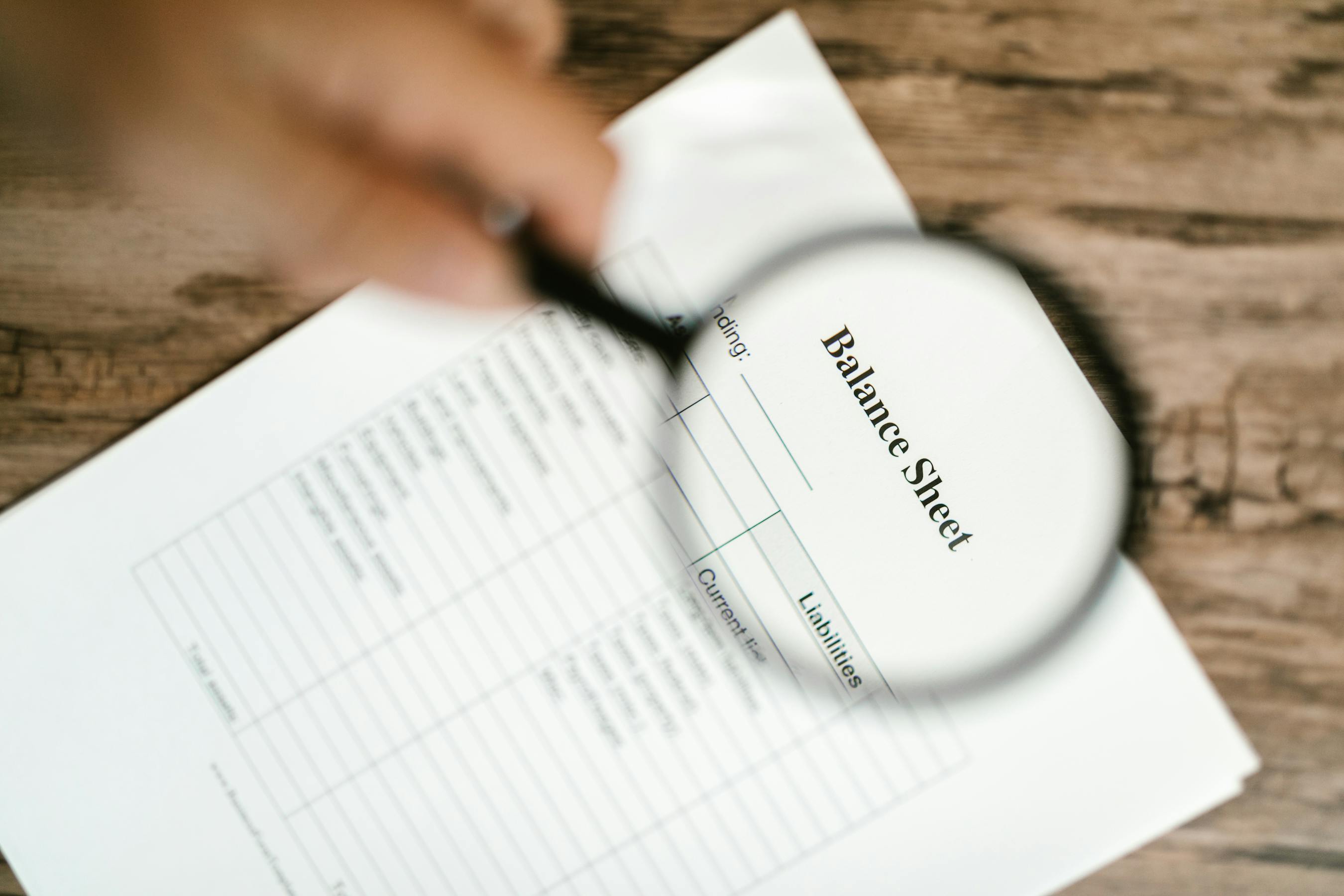 Illustrative document inspection with a magnifying glass on a printed page